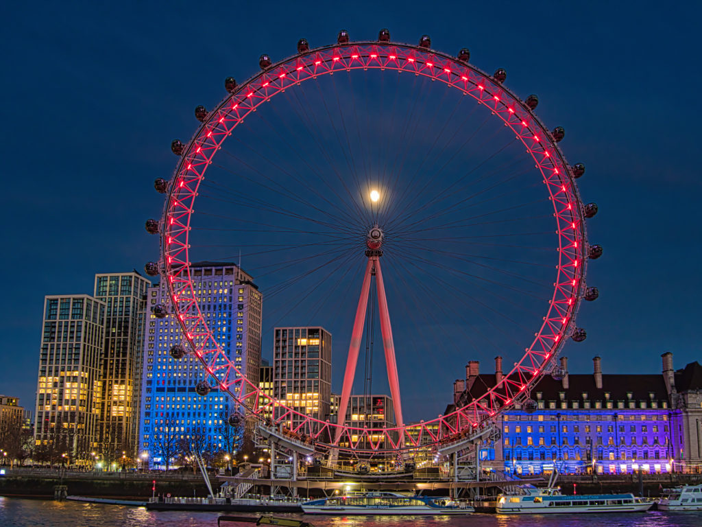 London Eye illuminated in red light